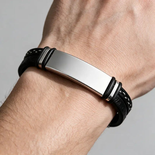 Slate braided leather bracelet with silver ID plate, worn on a man's wrist.