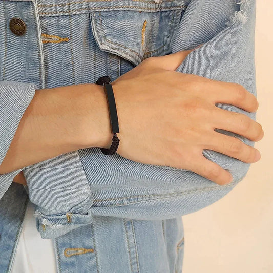 Man wearing the Solace black braided cord memorial ID bracelet