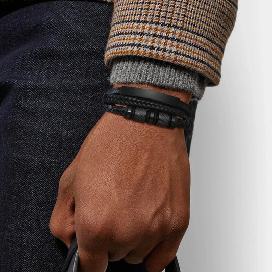 Man wearing the Customised Men's Bracelet – Vanguard Braided Leather Bracelet in the Black finish.