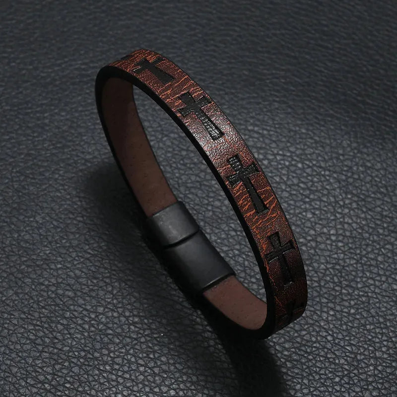 Brown leather bracelet with an embossed cross pattern and magnetic clasp