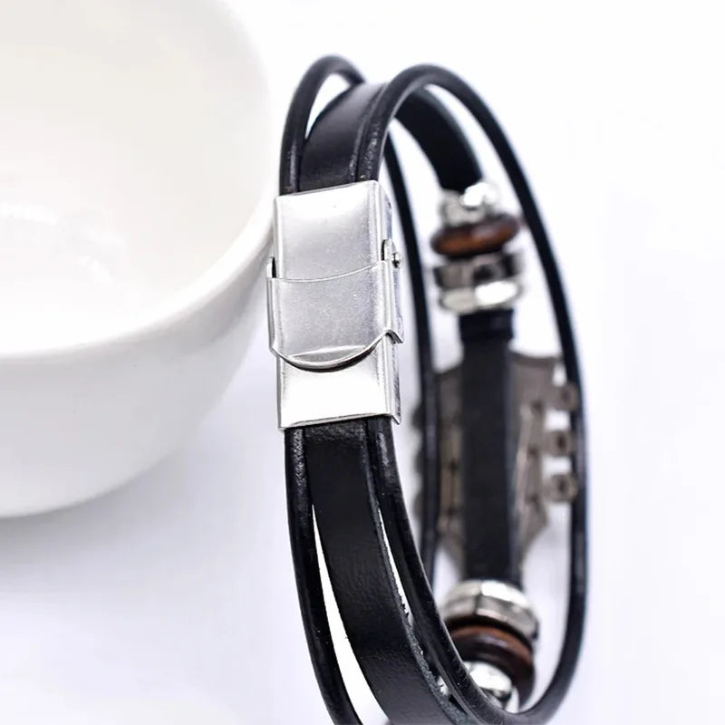Close-up of the folding magnetic clasp on a black leather guitar charm bracelet