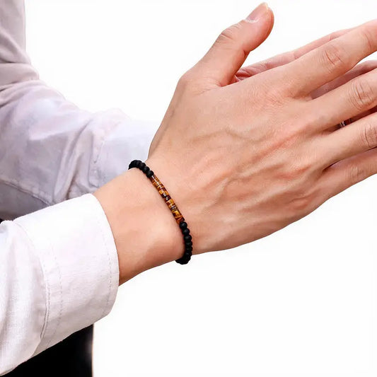 Zen Minimalist Accent Bead Bracelet worn on wrist, tiger eye and matte onyx beads