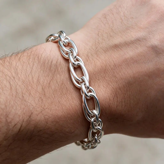 Silver oval belcher link chain bracelet worn on the wrist