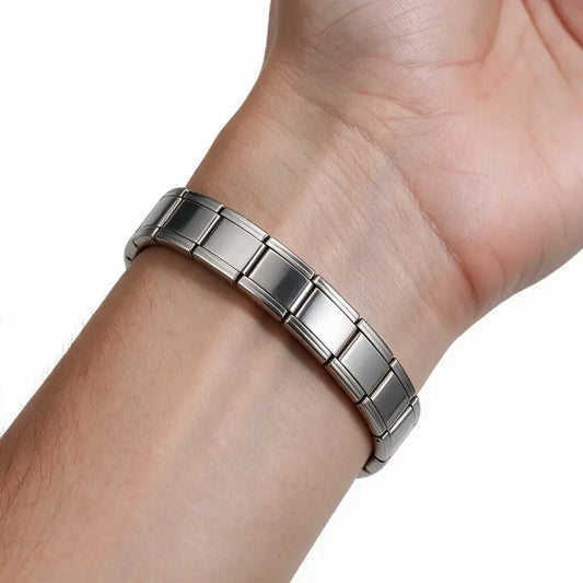 Silver stainless steel Italian modular link bracelet worn on wrist, white background