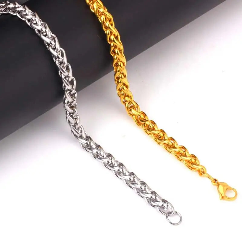 Silver and gold stainless steel wheat rope chain bracelets side by side