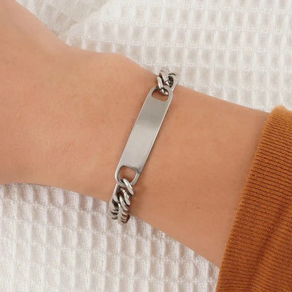 Forge chain link bracelet in silver, worn on wrist