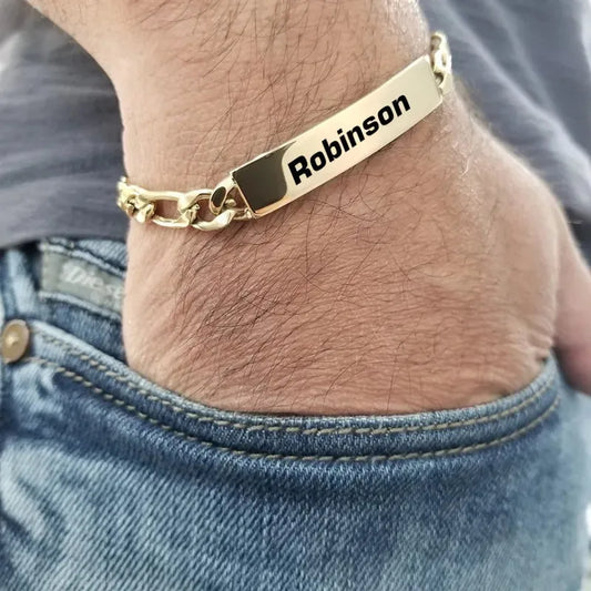 Forge chain link bracelet in gold with engraved nameplate, worn on wrist