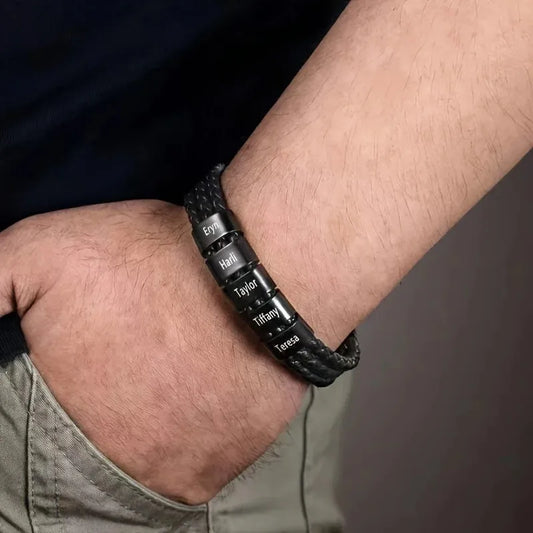 Man wearing the Customised Men's Bracelet – Heritage Family Names Bracelet with five engraved name beads.