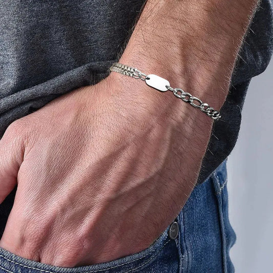 Man wearing the Insignia stainless steel initial ID bracelet on his wrist