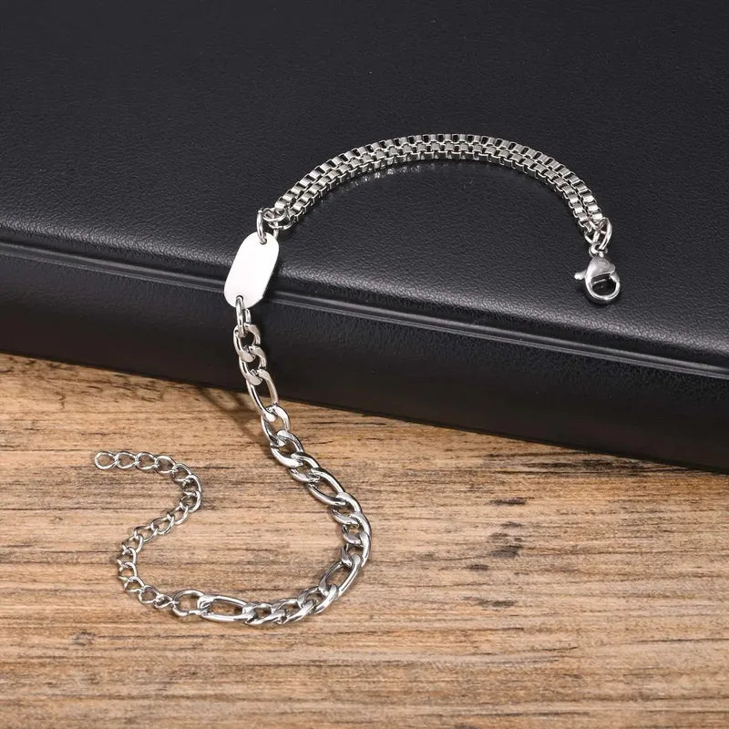 Insignia chain bracelet with ID tag on a dark leather background