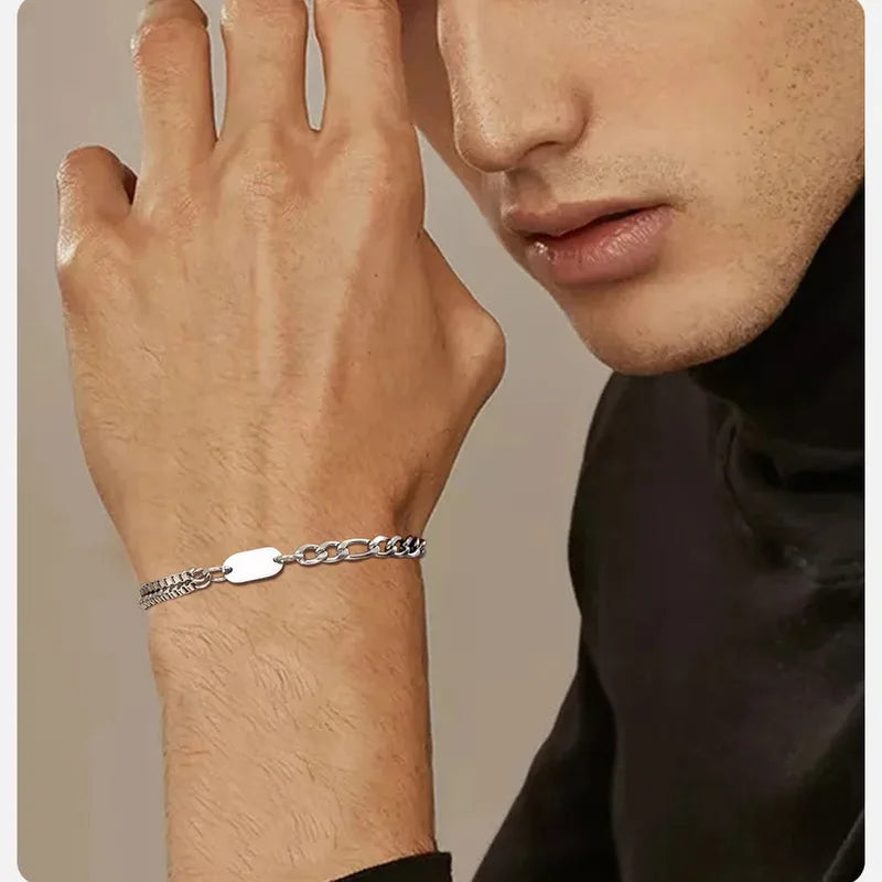 Close-up of a man's hand wearing the Insignia chain ID bracelet