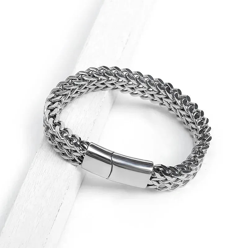 Customised Men's Bracelet – Ironclad Cuban Chain Bracelet resting on a white wood surface.