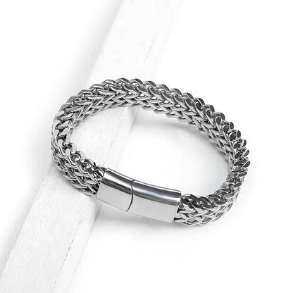 Customised Men's Bracelet – Ironclad Cuban Chain Bracelet resting on a white wood surface.