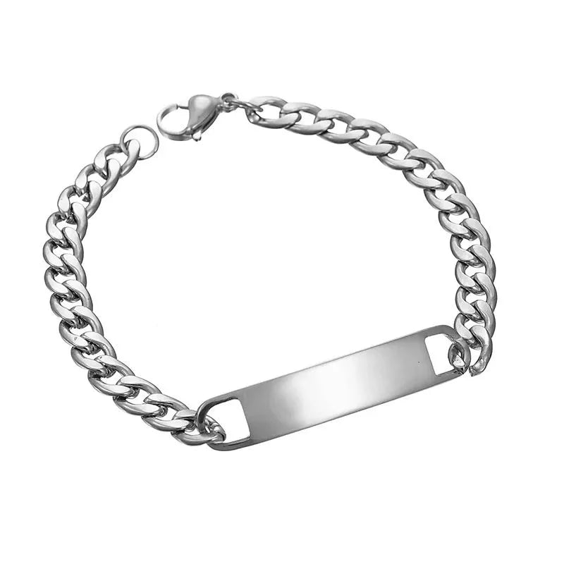 Blank silver nameplate bracelet on a plain white background