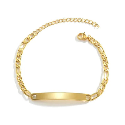 Blank gold figaro-link nameplate bracelet on a white background