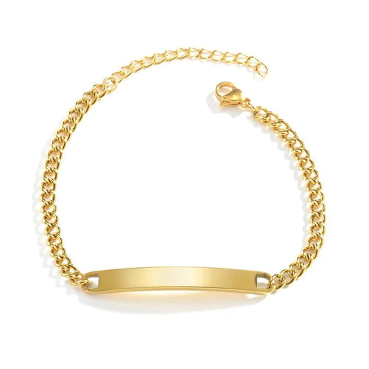 Blank gold nameplate bracelet on a plain white background