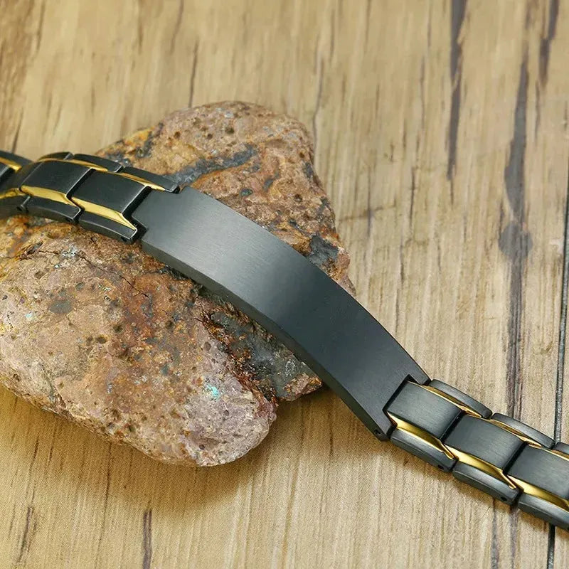 Customised Men's Bracelet – Marshal Line Watch-Band Bracelet in the Gold Line Black finish, shown on a stone and wood surface.