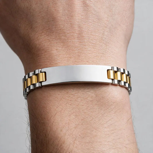 Regent two-tone link watch-band bracelet with silver ID plate, worn on a man's wrist.