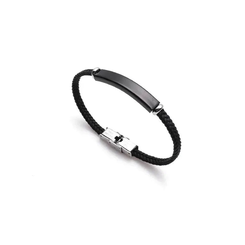 Renegade cord bracelets with black and gold ID plates on paper background