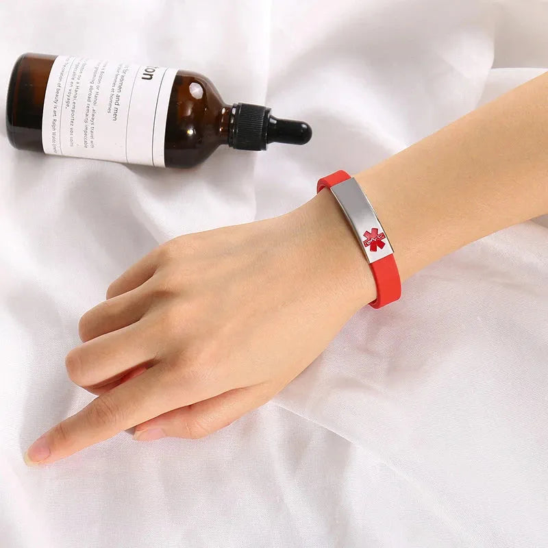 Woman wearing the Customised Men's Bracelet – Sentry Medical Alert Bracelet in the Red colour.