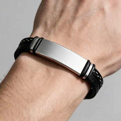 Slate braided leather bracelet with silver ID plate, worn on a man's wrist.