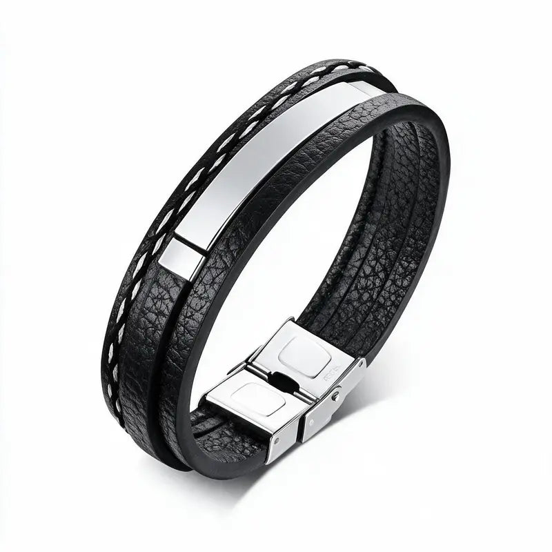 Tailor stitched leather bracelet with blank silver ID plate, on a plain white background.