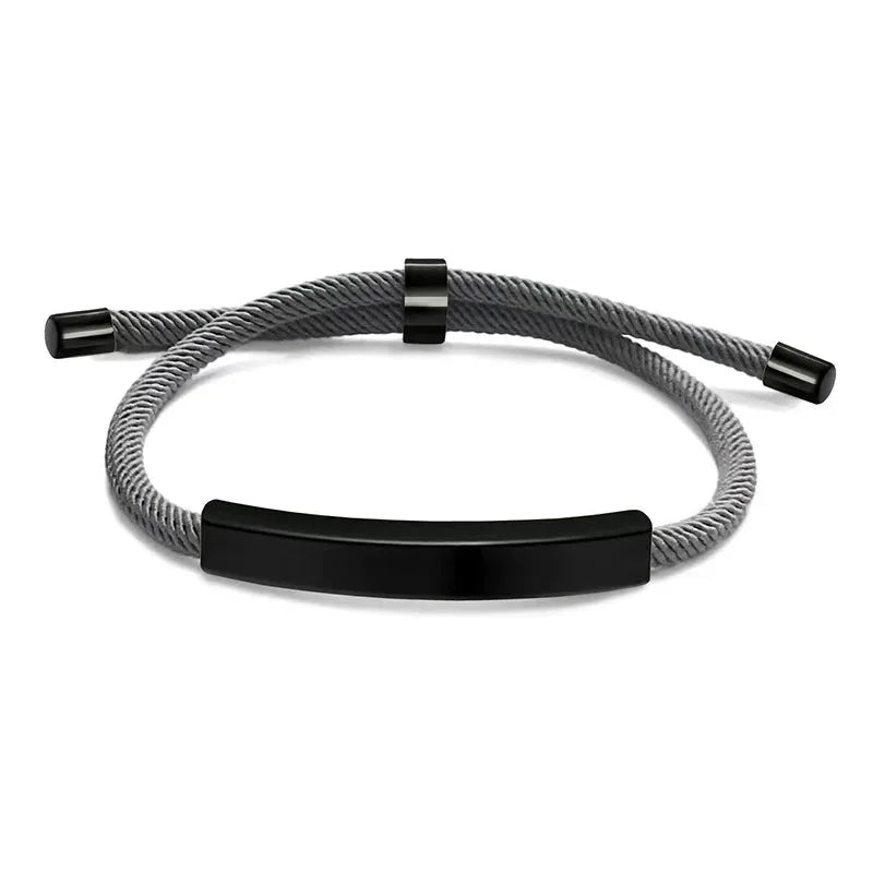 Voyager adjustable cord bracelet in grey with black-tone nameplate