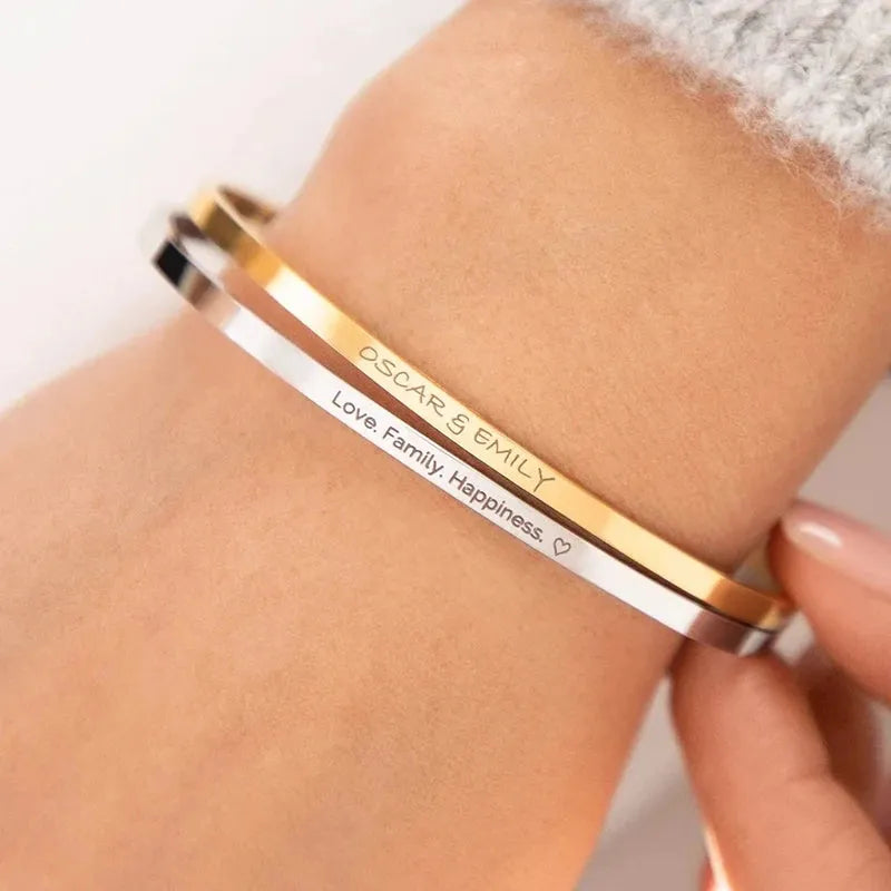 Woman wearing the Customised Men's Bracelet – Whisper Cuff Bangle in Gold and Silver together.