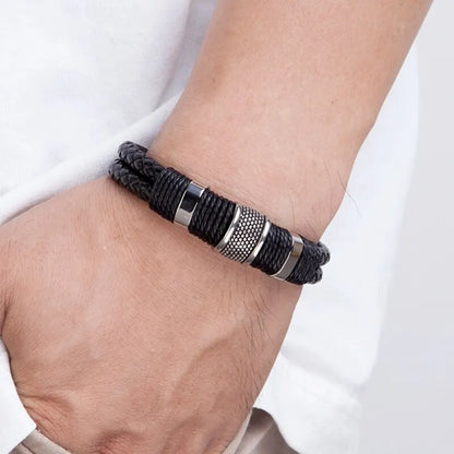 Black woven leather rope bracelet worn on a man's wrist