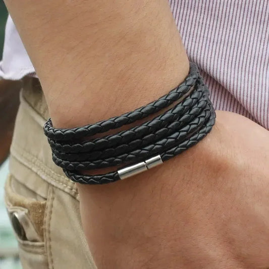 Charcoal grey braided leather bracelet wrapped five times around the wrist
