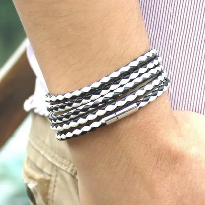 Black and white two-tone braided leather bracelet wrapped five times around the wrist