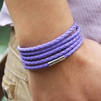 Purple braided leather bracelet wrapped five times around the wrist