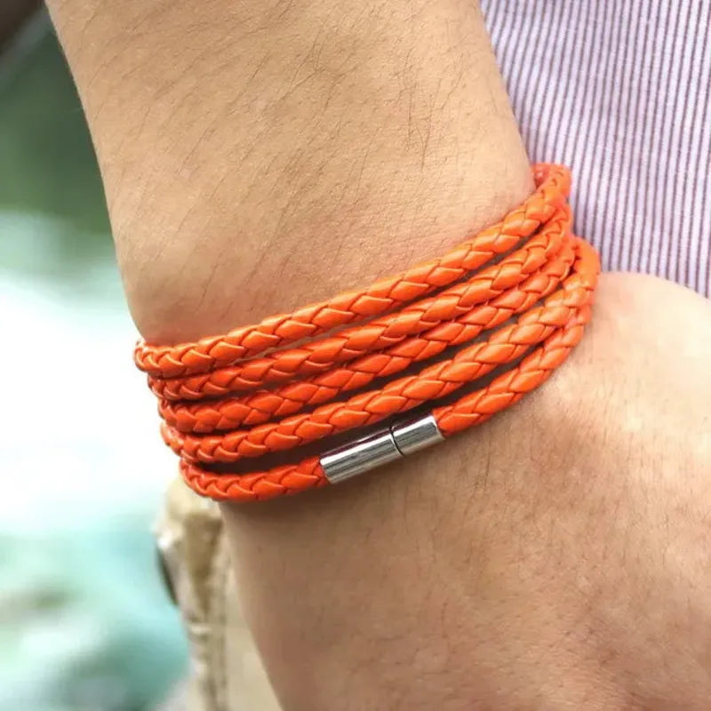 Orange braided leather bracelet wrapped five times around the wrist