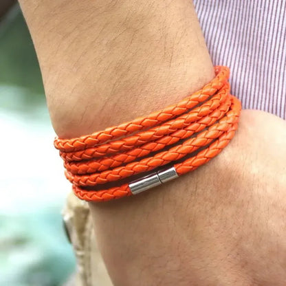 Orange braided leather bracelet wrapped five times around the wrist