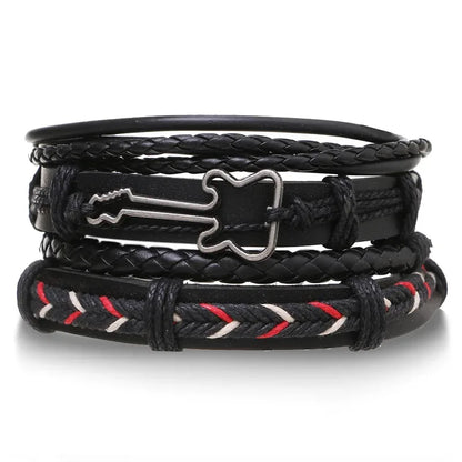 Black leather layered bracelet stack with a silver guitar charm and red-and-white embroidered thread accent, on a white background.