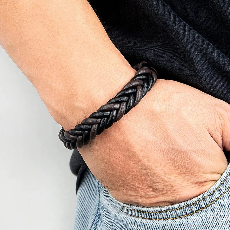 Man wearing a dark brown leather herringbone braid bracelet on his wrist