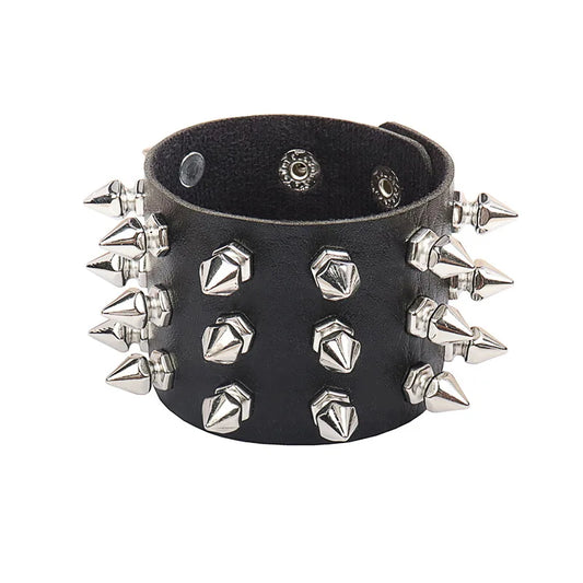 Black leather cuff bracelet with three rows of silver spike studs, on a white background