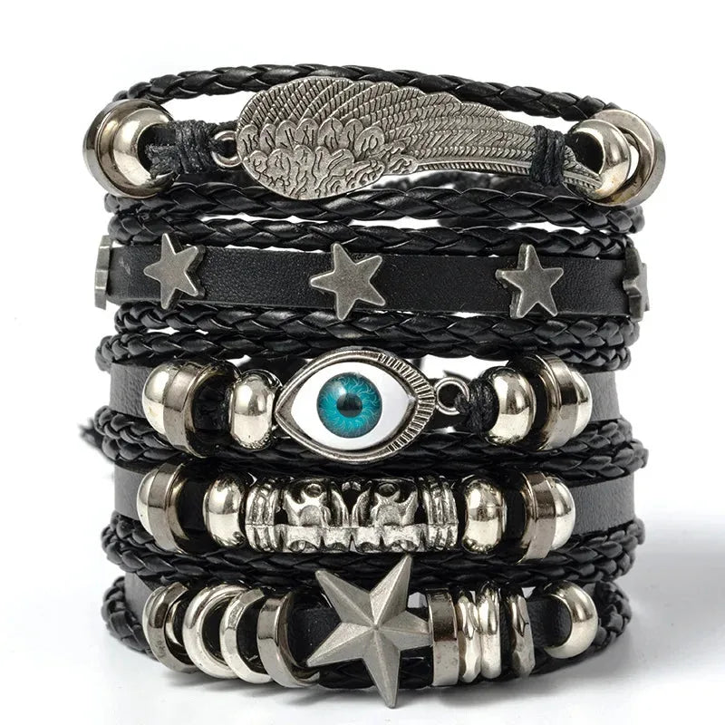 Five-piece evil eye leather bracelet stack with a feathered wing charm and star charm, on a white background.