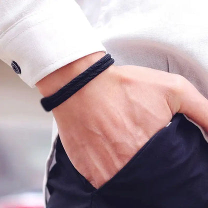 Black Milan cord bracelet worn on the wrist