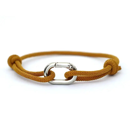 Dark yellow nylon cord bracelet with an alloy spring-clip clasp