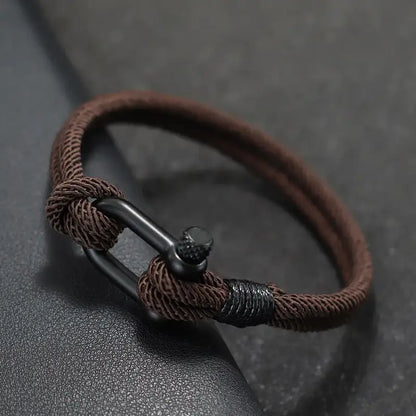 Brown double-strand Milan rope bracelet with a stainless steel shackle clasp
