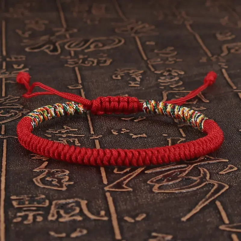 Red braided cord bracelet hand-knotted with the traditional King Kong knot