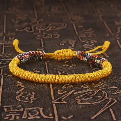 Yellow braided cord bracelet hand-knotted with the King Kong knot