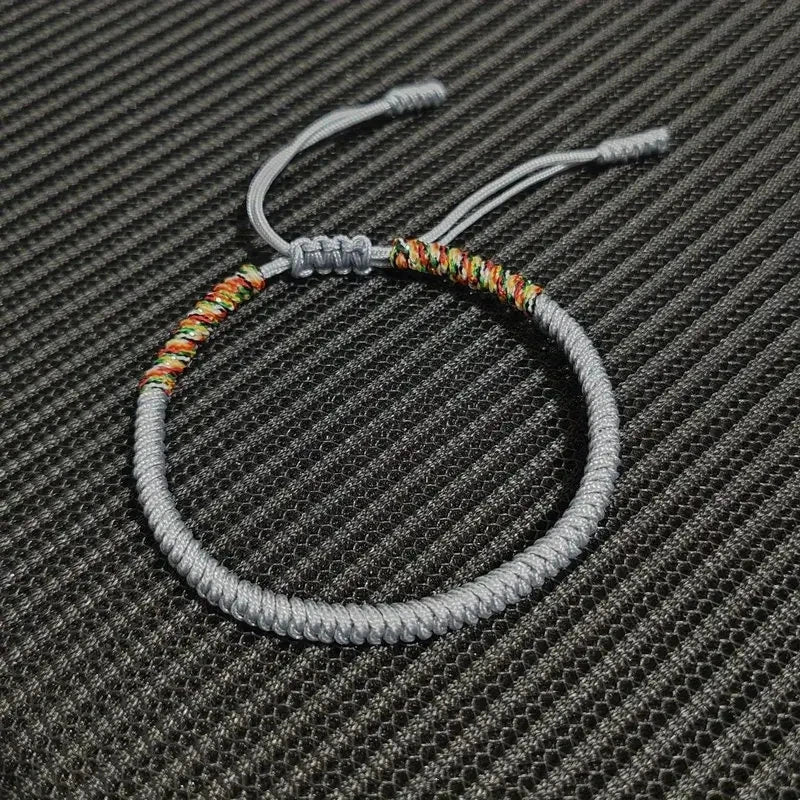 Grey braided cord bracelet hand-knotted with the King Kong knot