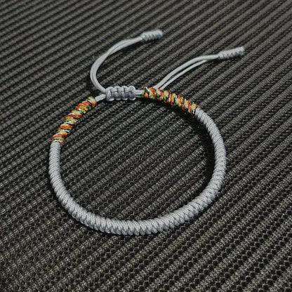 Grey braided cord bracelet hand-knotted with the King Kong knot