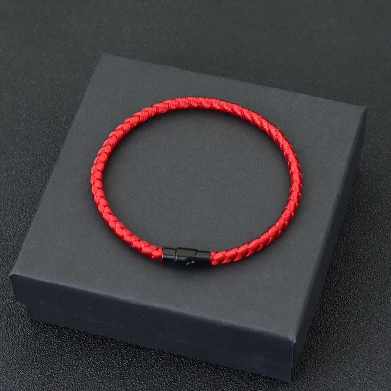 Red braided cord bracelet displayed in a gift box