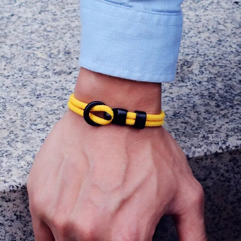 Yellow double-wrap rope bracelet worn on the wrist