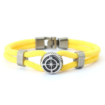 Yellow double-strand rope bracelet with a silver-tone compass charm