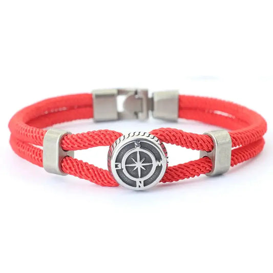 Red double-strand rope bracelet with an antique silver-tone compass charm