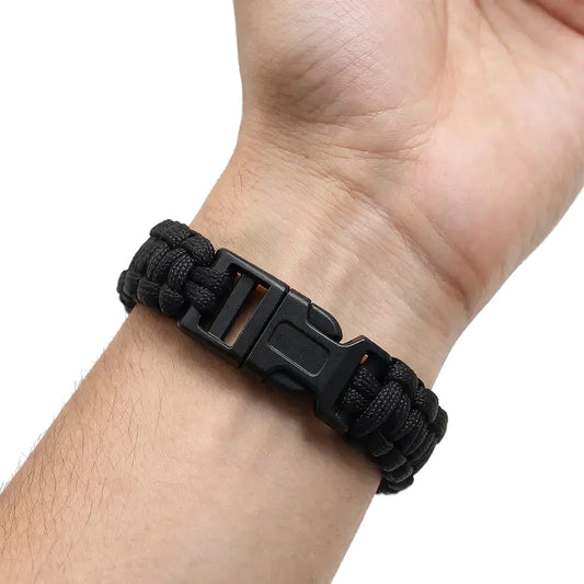 Cobra-weave paracord survival bracelet in Style F colorway with a plastic side-release buckle, worn on wrist